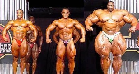 3 bodybuilders on stage each larger than the next